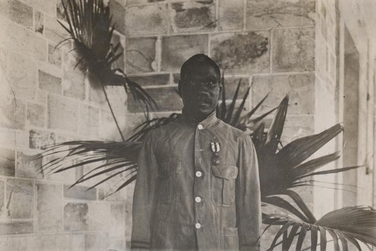 Ayaiga standing an posing for a photograph after having received the Albert Medal. Medal is pinned on left hand chest. 