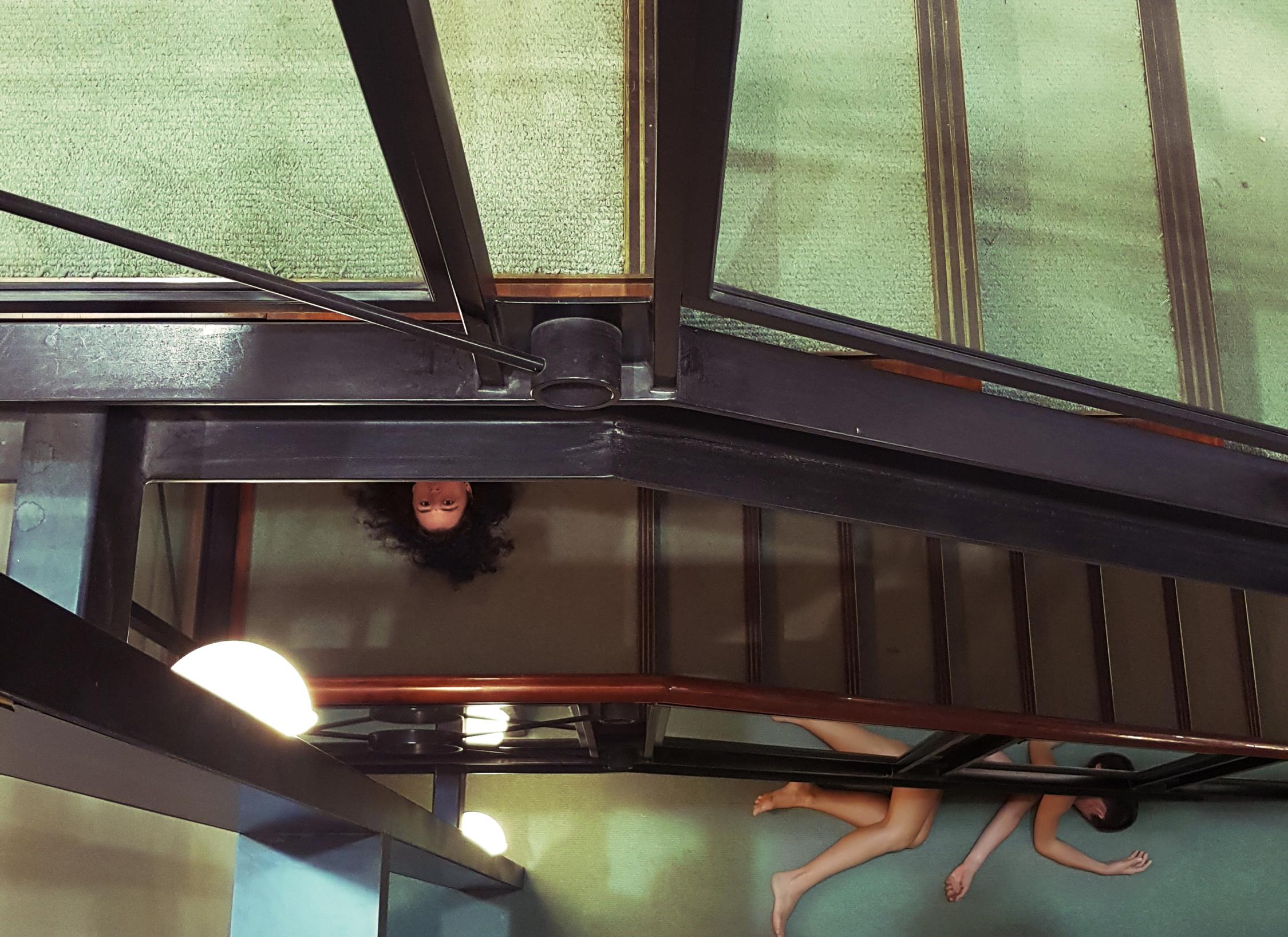 Cj Fraser-Bell and Kelly Beniforti under the stairwell