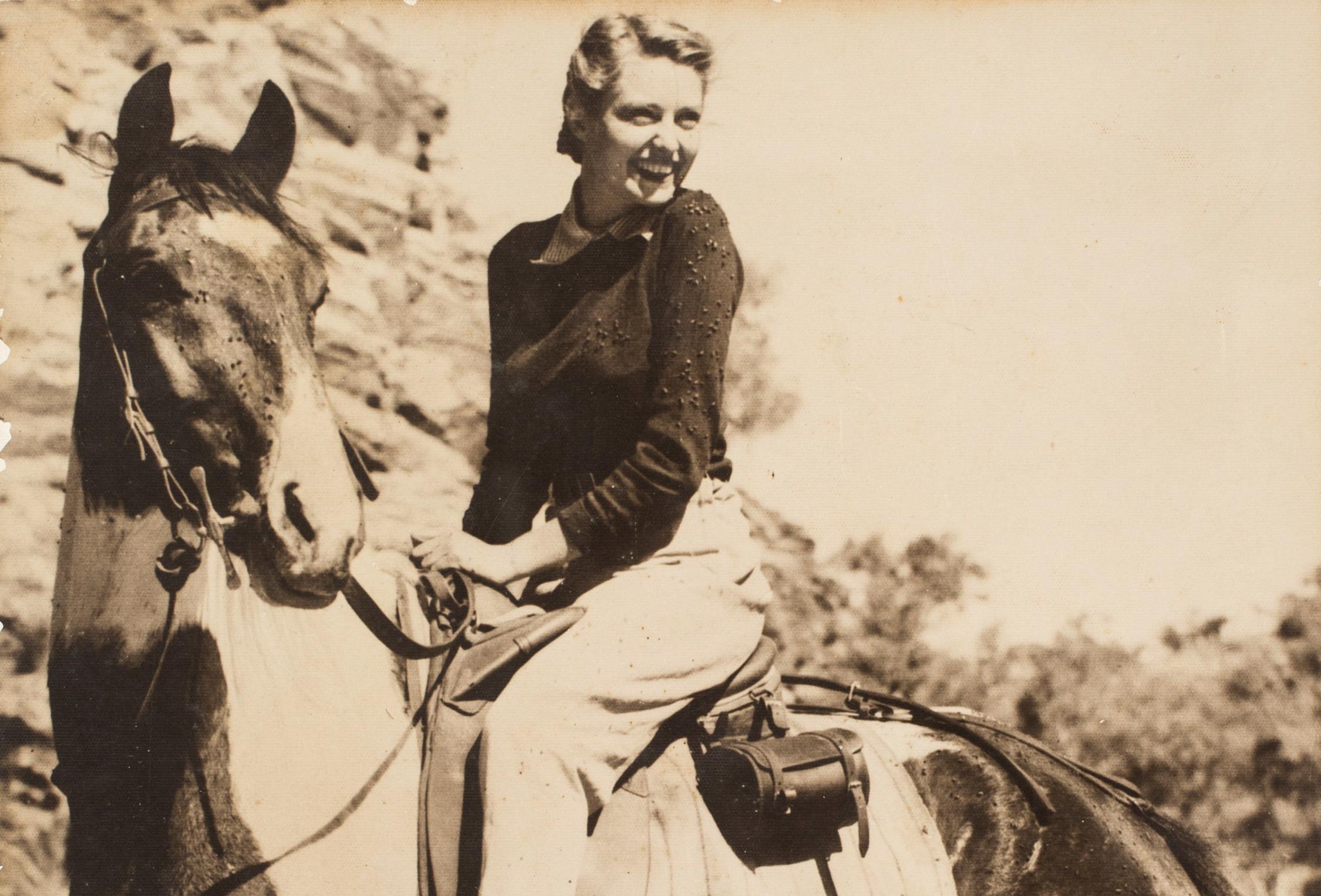 Woman riding a horse